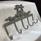 Patinated metal wall bracket and porcelain