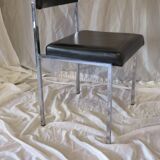 Modernist chair in chromed metal and black imitation leather