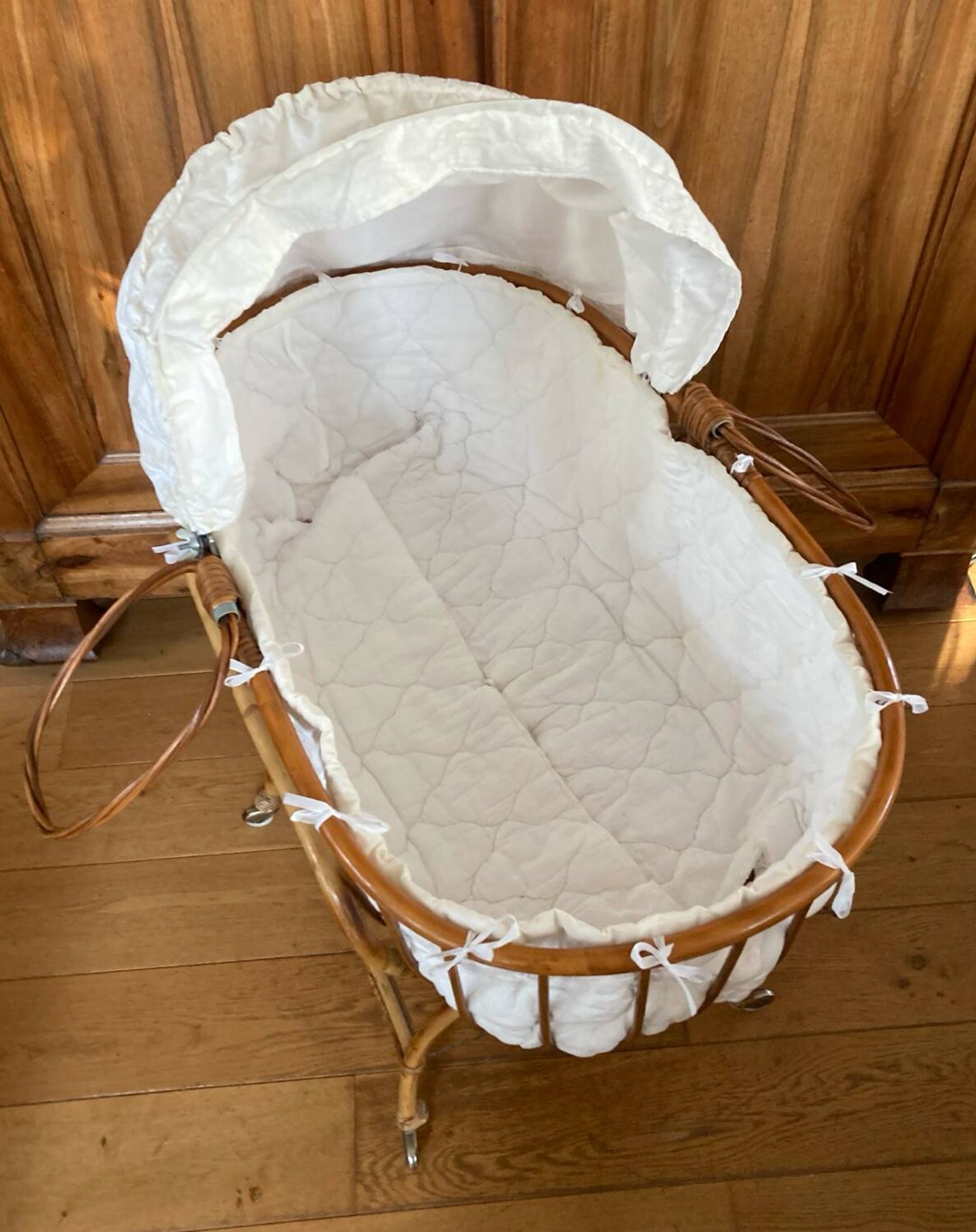 Bamboo, rattan, wicker cradle bassinet from the 1960s with a foldable support.