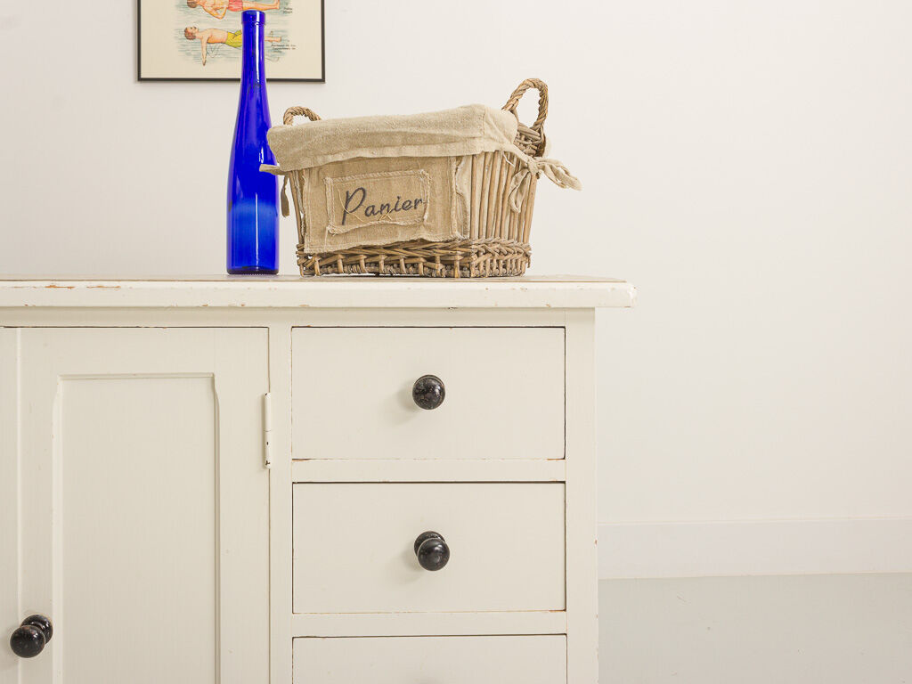 Small accent cabinet with drawers and swing doors