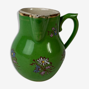 Green milk jug with enamelled flowers