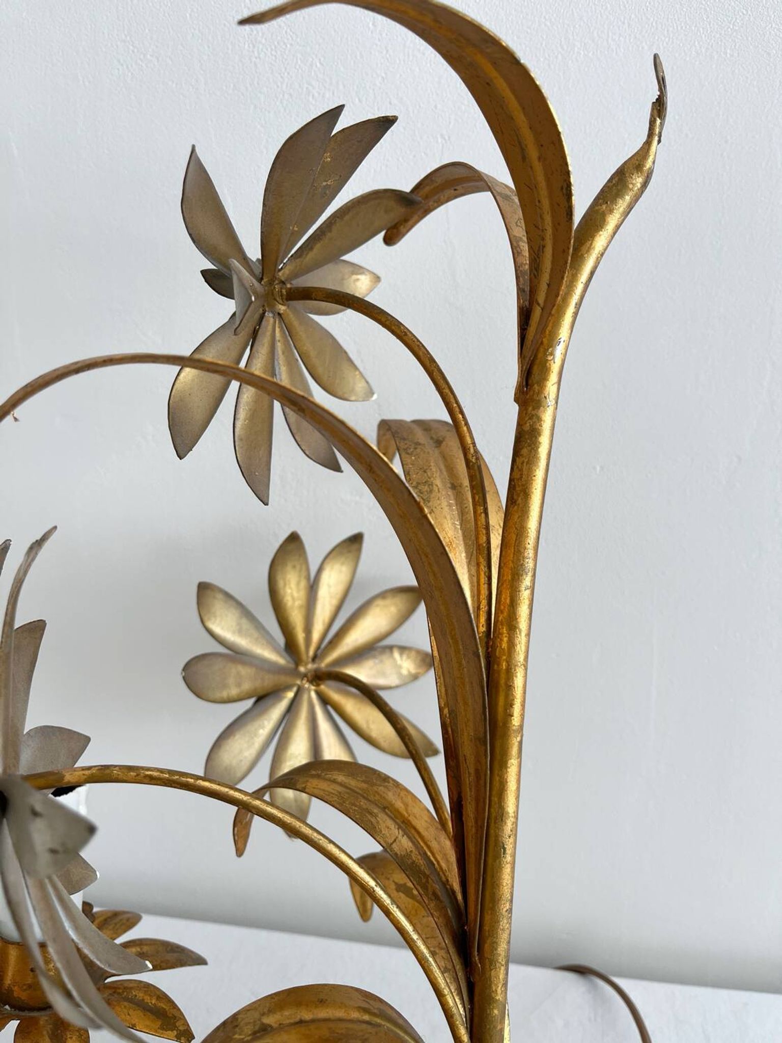 Vintage Hollywood Regency gold metal leaf wall sconce.