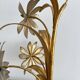 Vintage Hollywood Regency gold metal leaf wall sconce.