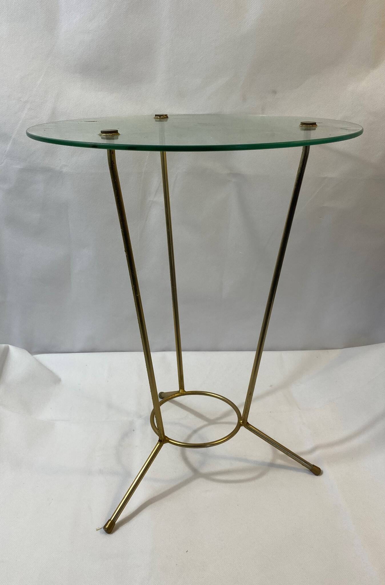 Golden metal tripod pedestal table and glass top
