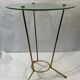 Golden metal tripod pedestal table and glass top