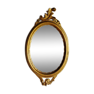 Italian oval mirror in gilded wood - 45x25cm