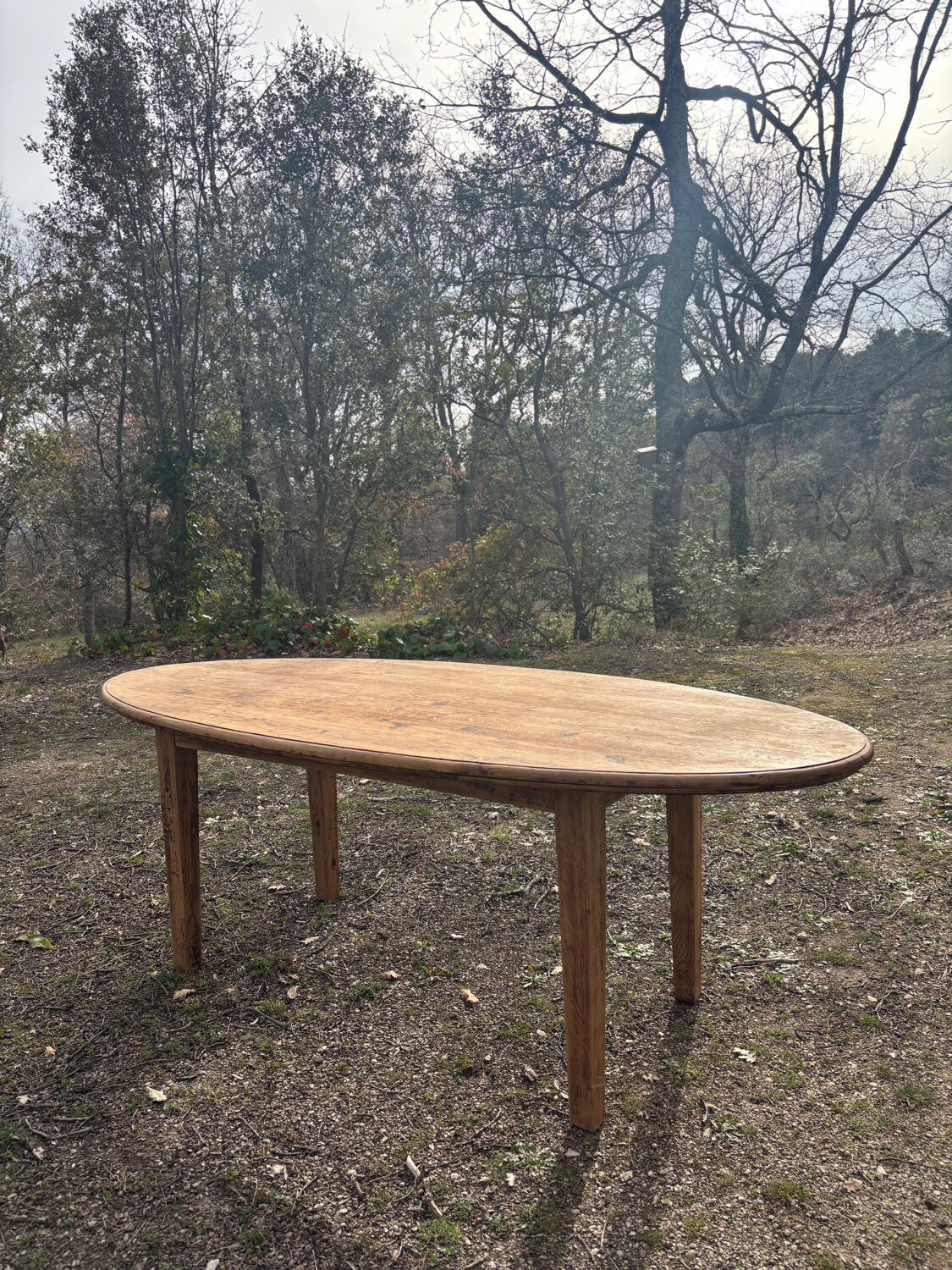 Oval solid wood dining table