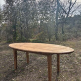 Oval solid wood dining table