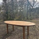 Oval solid wood dining table