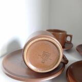 Stoneware coffee cups and saucers