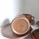 Stoneware coffee cups and saucers