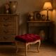 Antique upholstered stool in red velvet and carved wood
