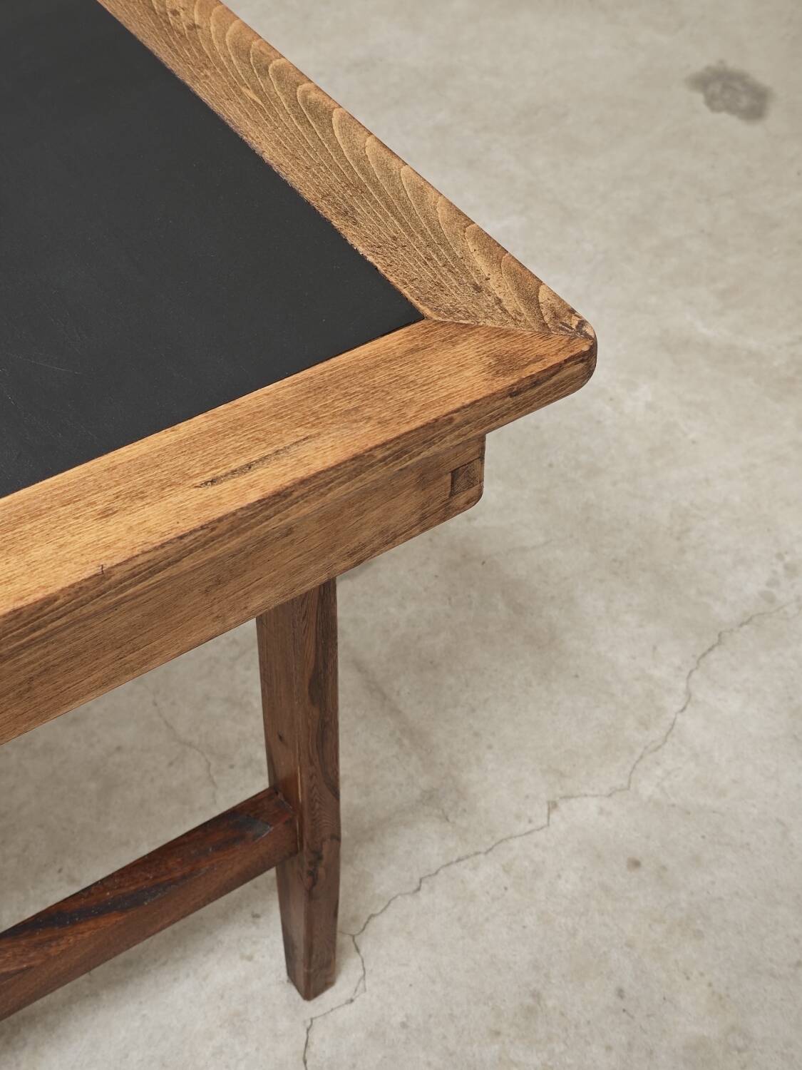 Vintage workshop folding table in oak with a hand-patinated black top.