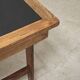 Vintage workshop folding table in oak with a hand-patinated black top.