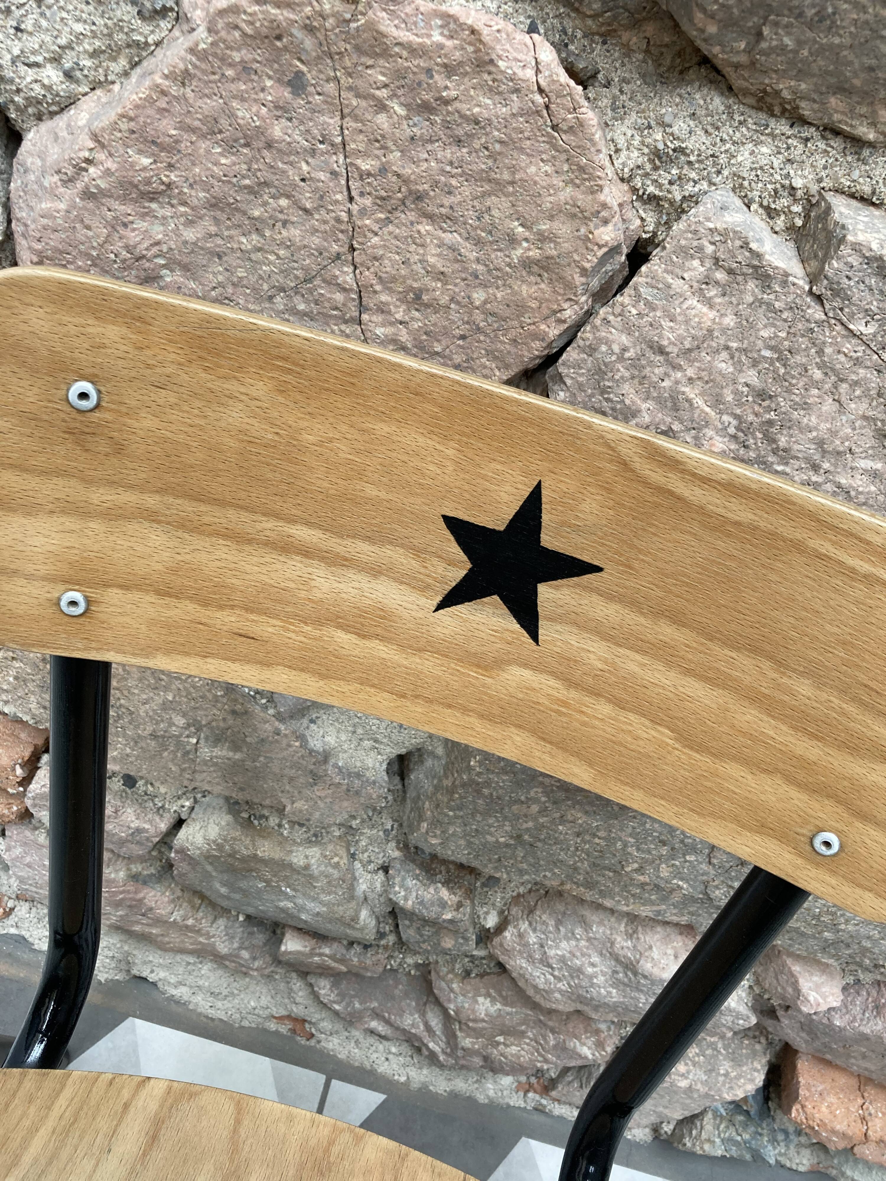 Pair of renovated school chairs with star pattern