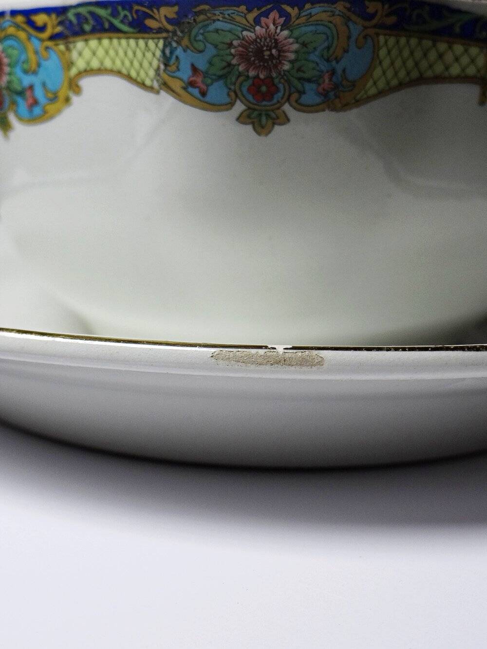 Old Luneville sauce boat, opaque porcelain with polychrome decoration.