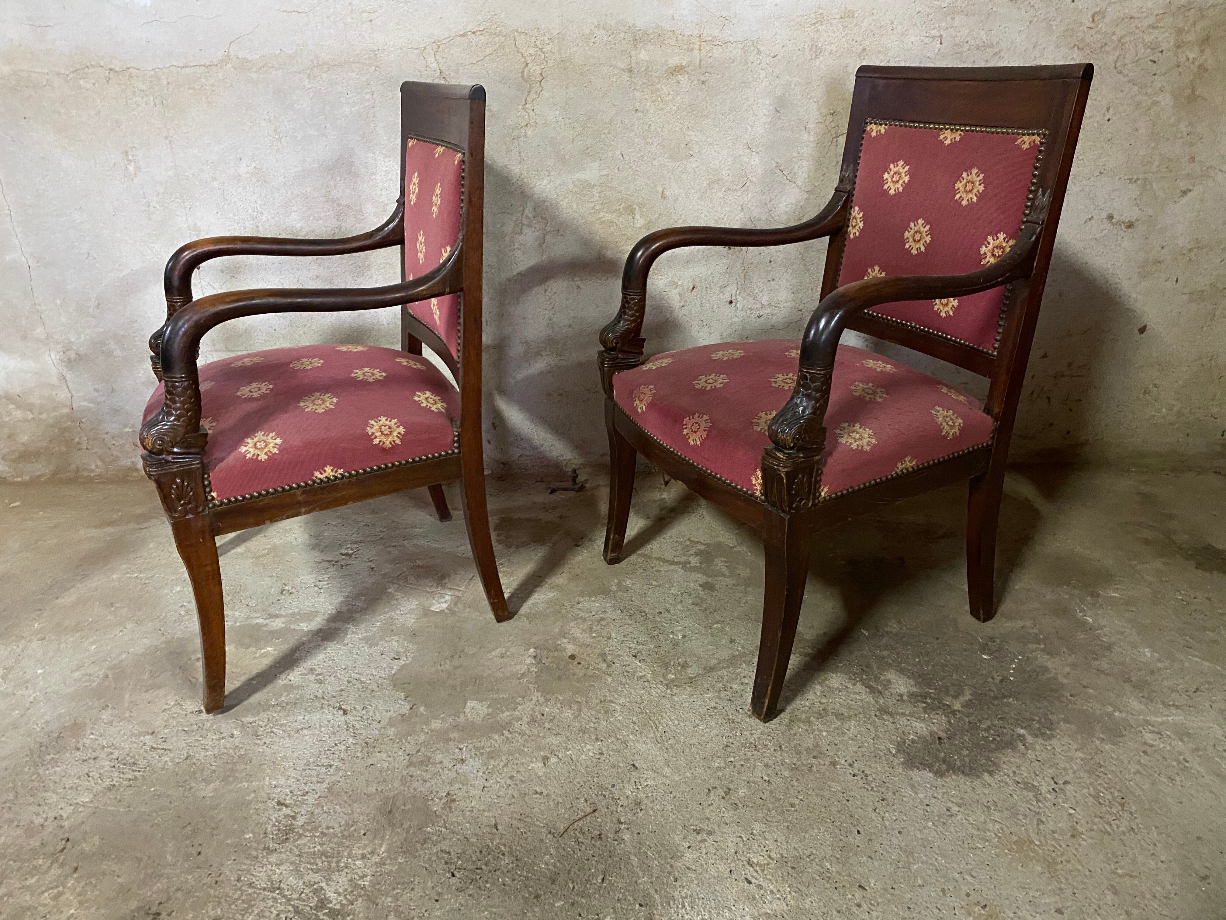 Pair of empire-style armchairs with dolphins