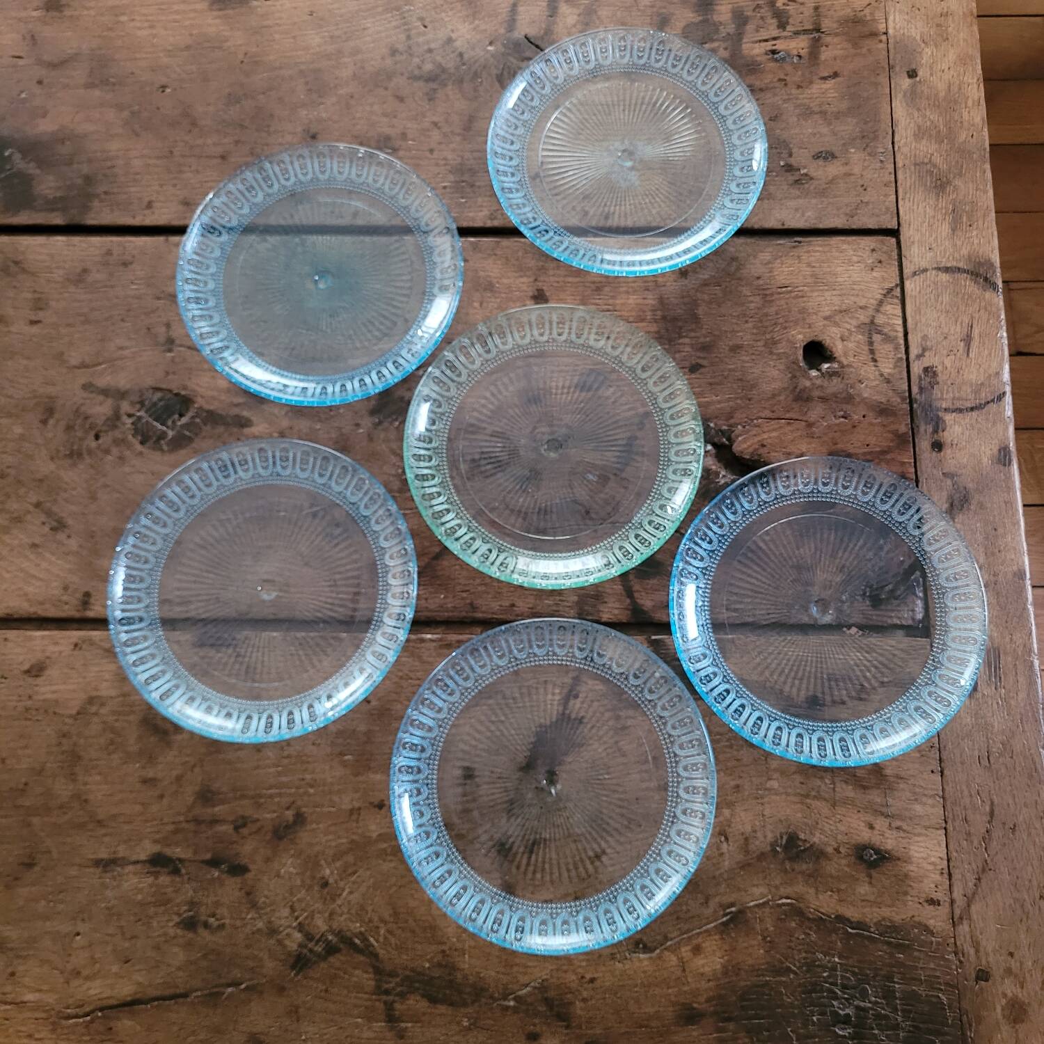 6 molded glass plates – 5 bluish, 1 aqua green