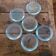 6 molded glass plates – 5 bluish, 1 aqua green