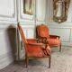 Pair of transitional carved wooden armchairs, 18th century