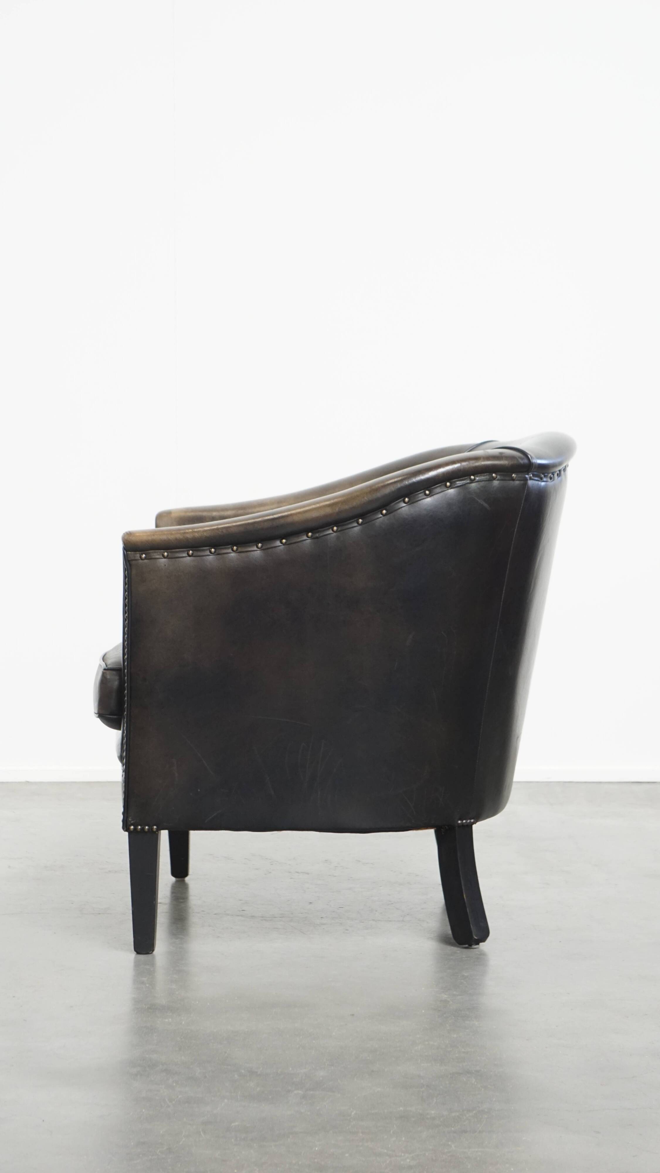 Fauteuil club noir/gris en cuir de mouton