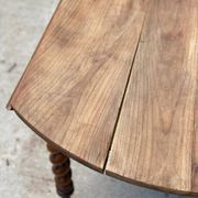 Louis Philippe oval table with shutters, 19th century, solid oak wood, twisted leg