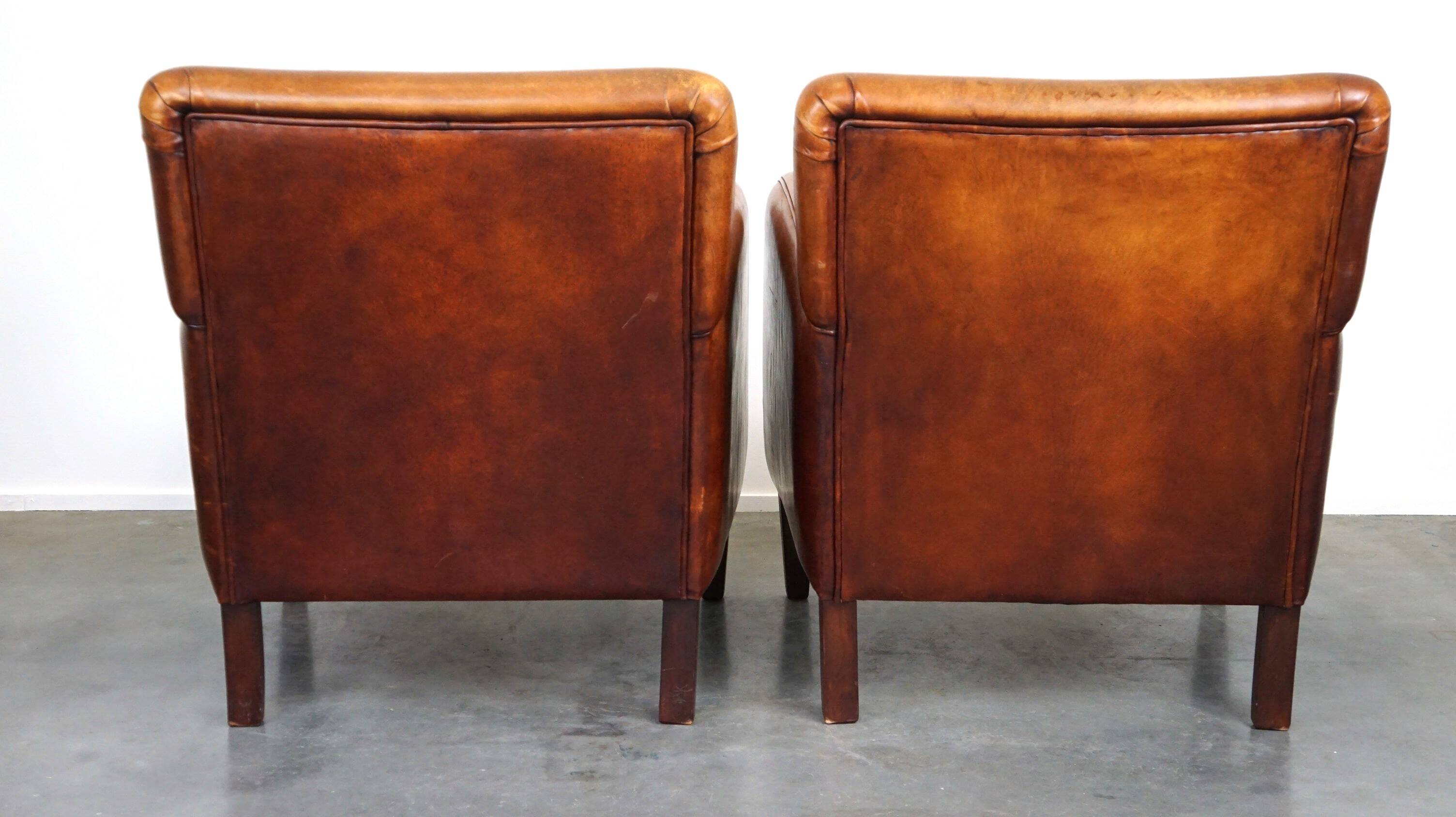Set of 2 subtle sheepskin leather armchairs with a beautiful warm color scheme