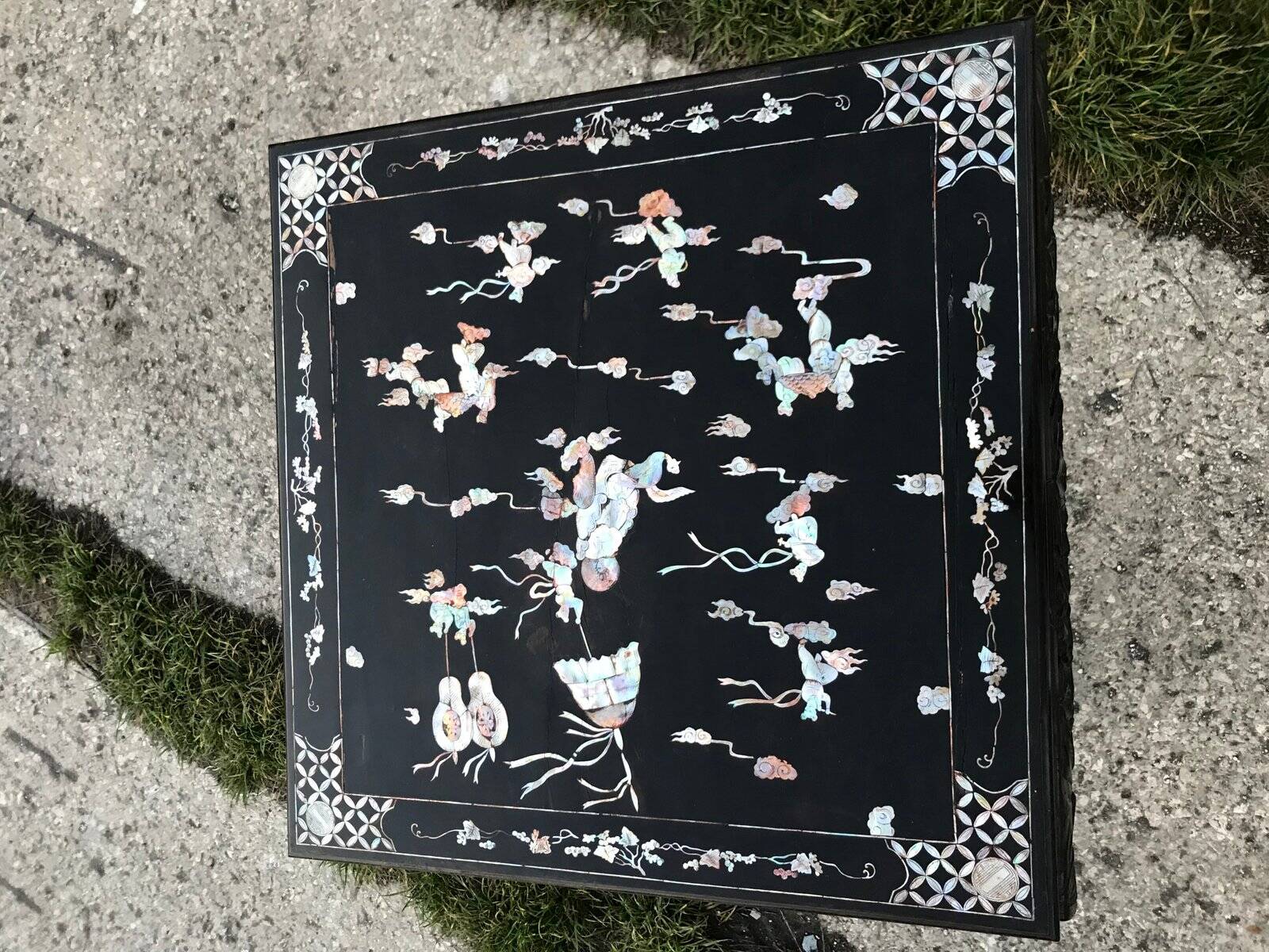 Chinese black lacquer side table with multicoloured inlays, 1950s.