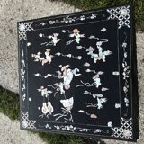 Chinese black lacquer side table with multicoloured inlays, 1950s.