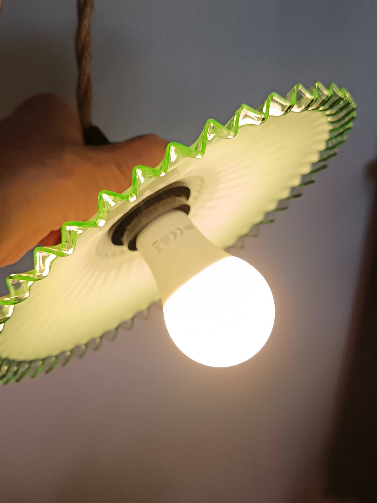 Portable lamp with green and white glass suspension