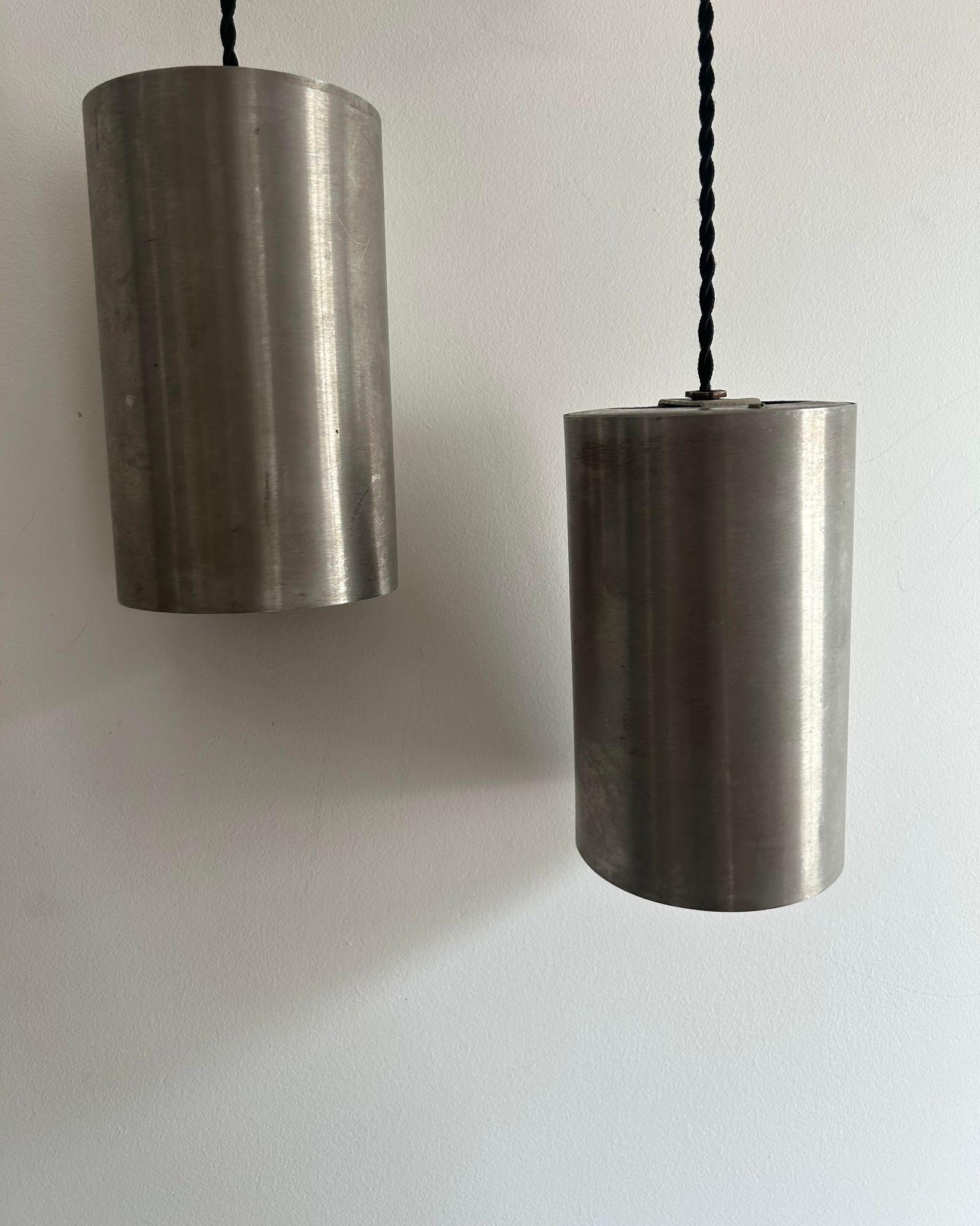 Pair of vintage brushed metal pendant lamps, France 1960