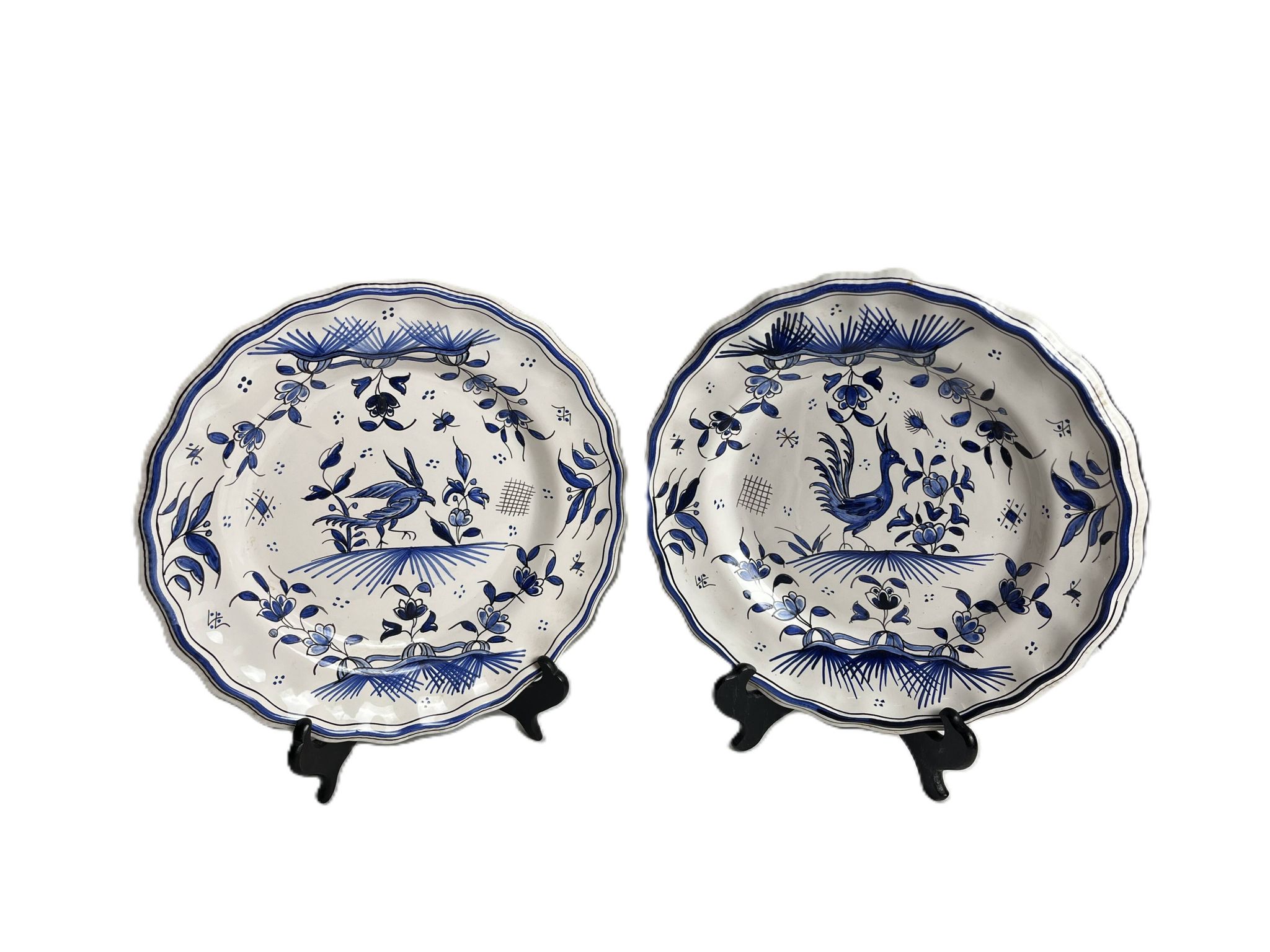 Moustiers, pairs of plates with wading bird design, scalloped edge, early 20th century.