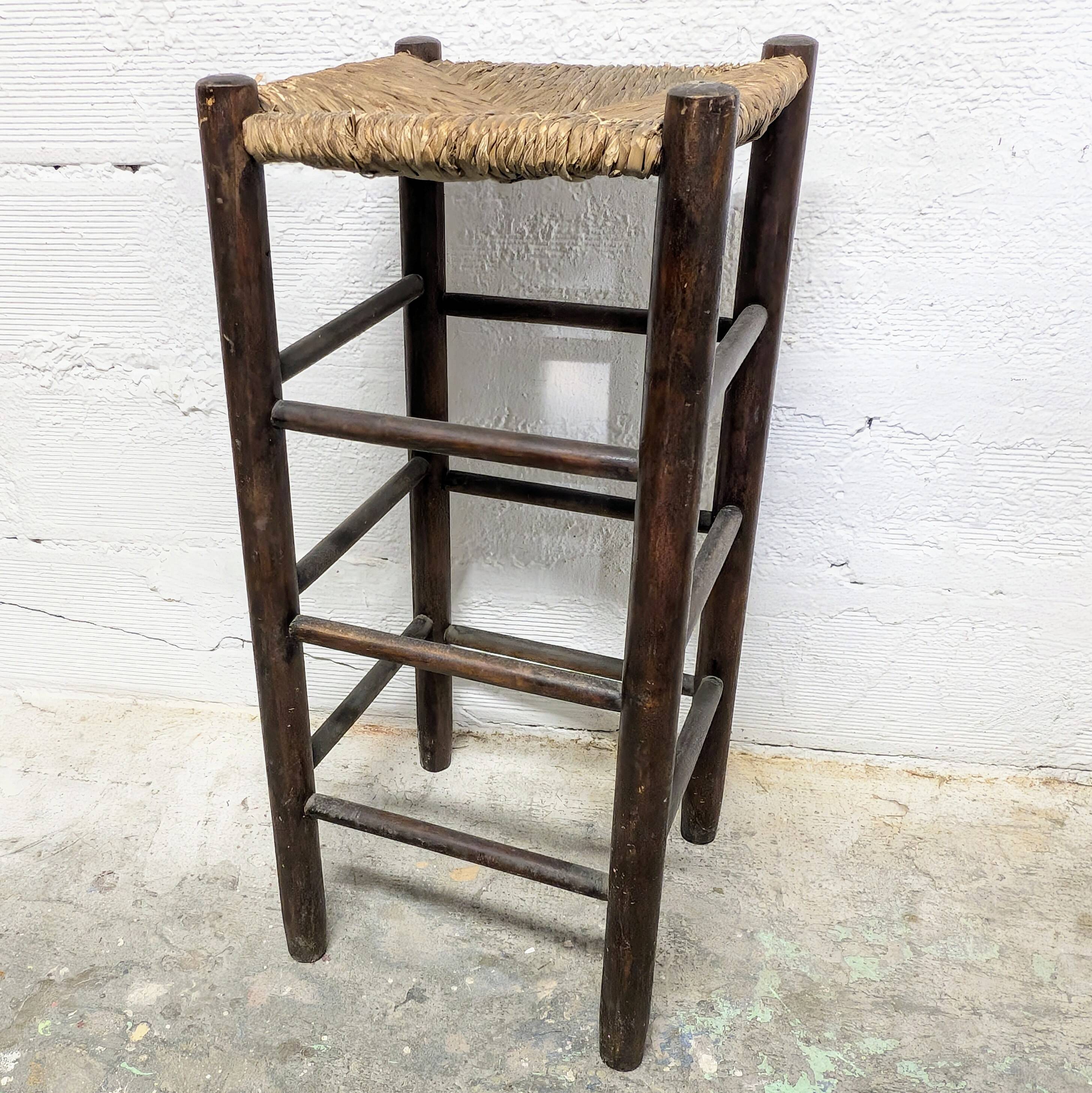 High stool made of wood and straw