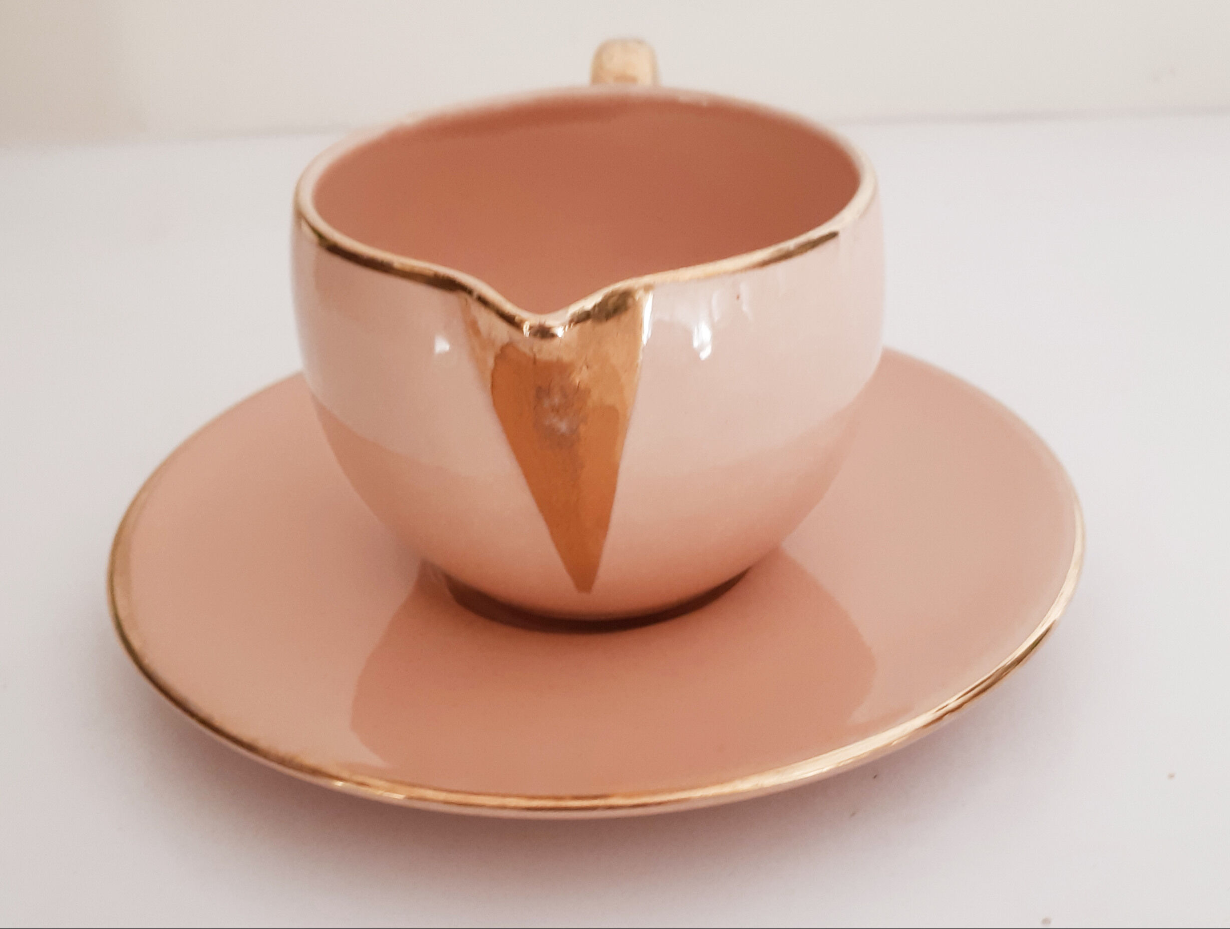 Cup pourer in pink and gold earthenware, vintage