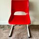 Children's chair in white metal and red plastic