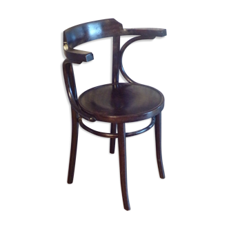 Vintage dark curved wood armchair
