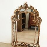 Antique mirror with rococo-style pareclose, in gilded wood, 19th century