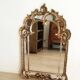 Antique mirror with rococo-style pareclose, in gilded wood, 19th century