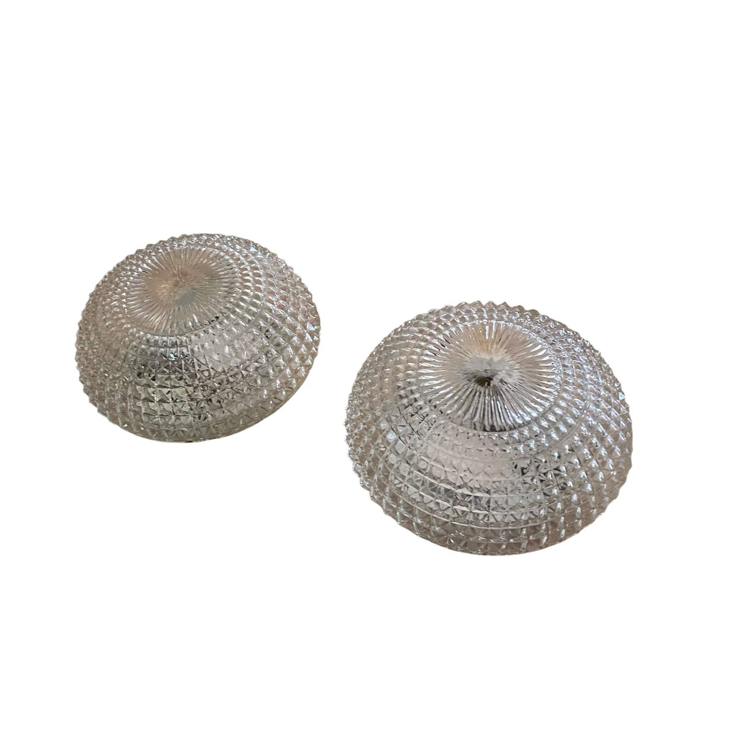 Large pair of round wall sconces ceiling lights in transparent glass.