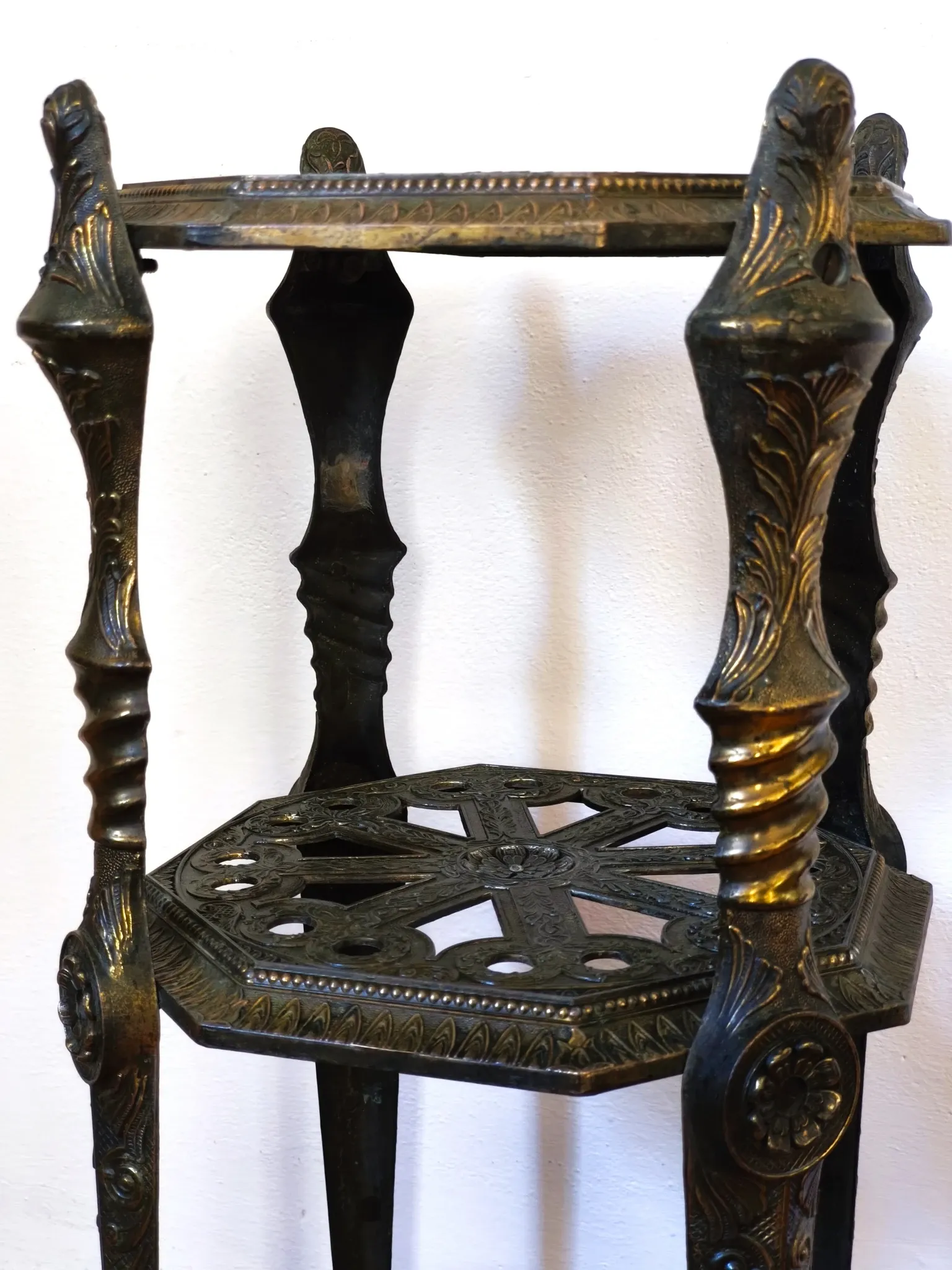 Italian side table with three openwork shelves in patinated metal.