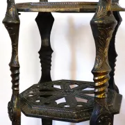Italian side table with three openwork shelves in patinated metal.