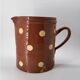 Old pitcher with polka dots savoyard pottery in glazed terracotta alsace