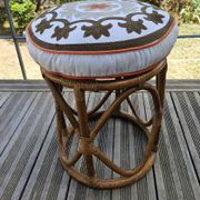 Rattan pouffe with cushion