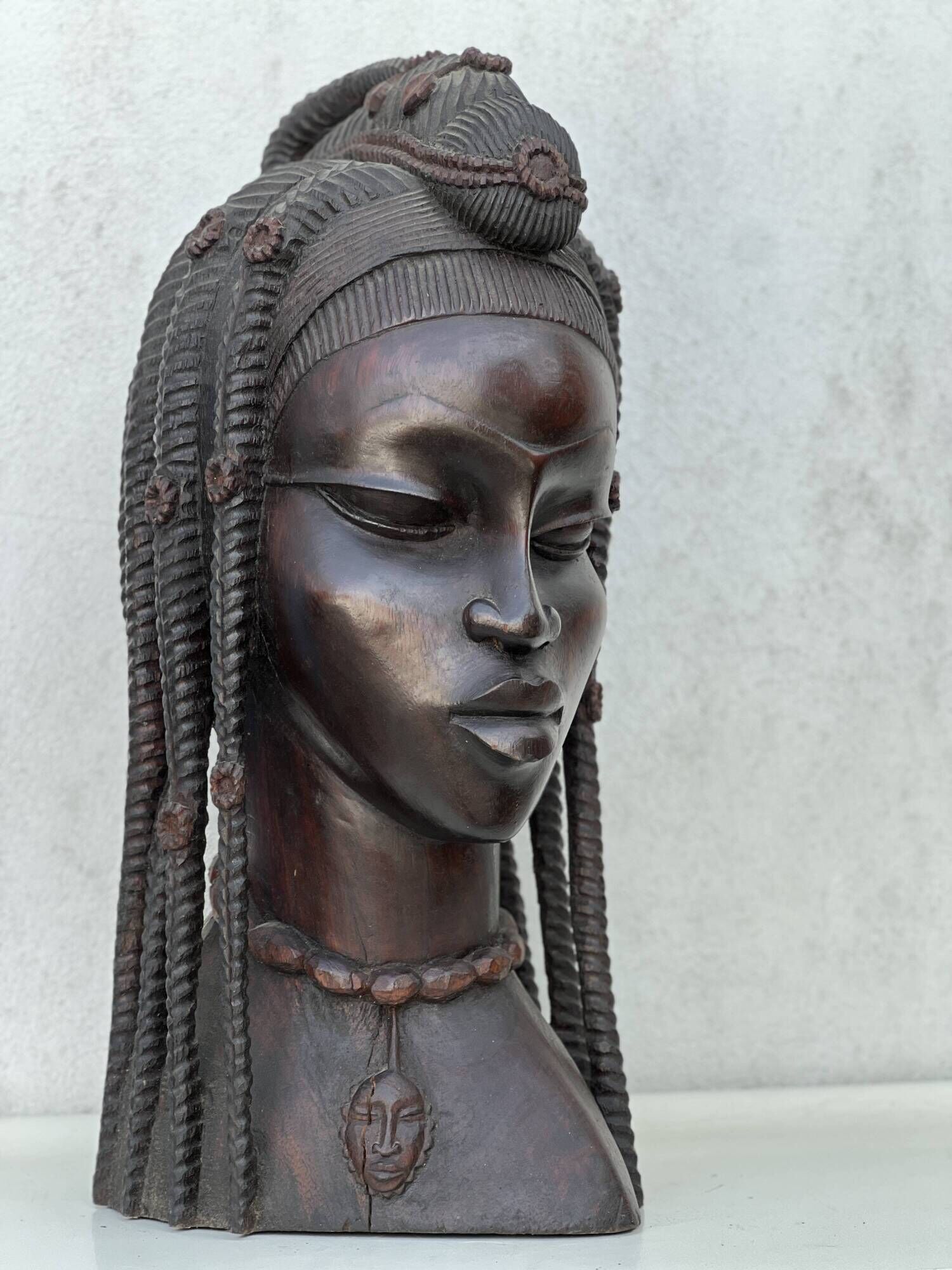 Large wooden bust of an African woman.