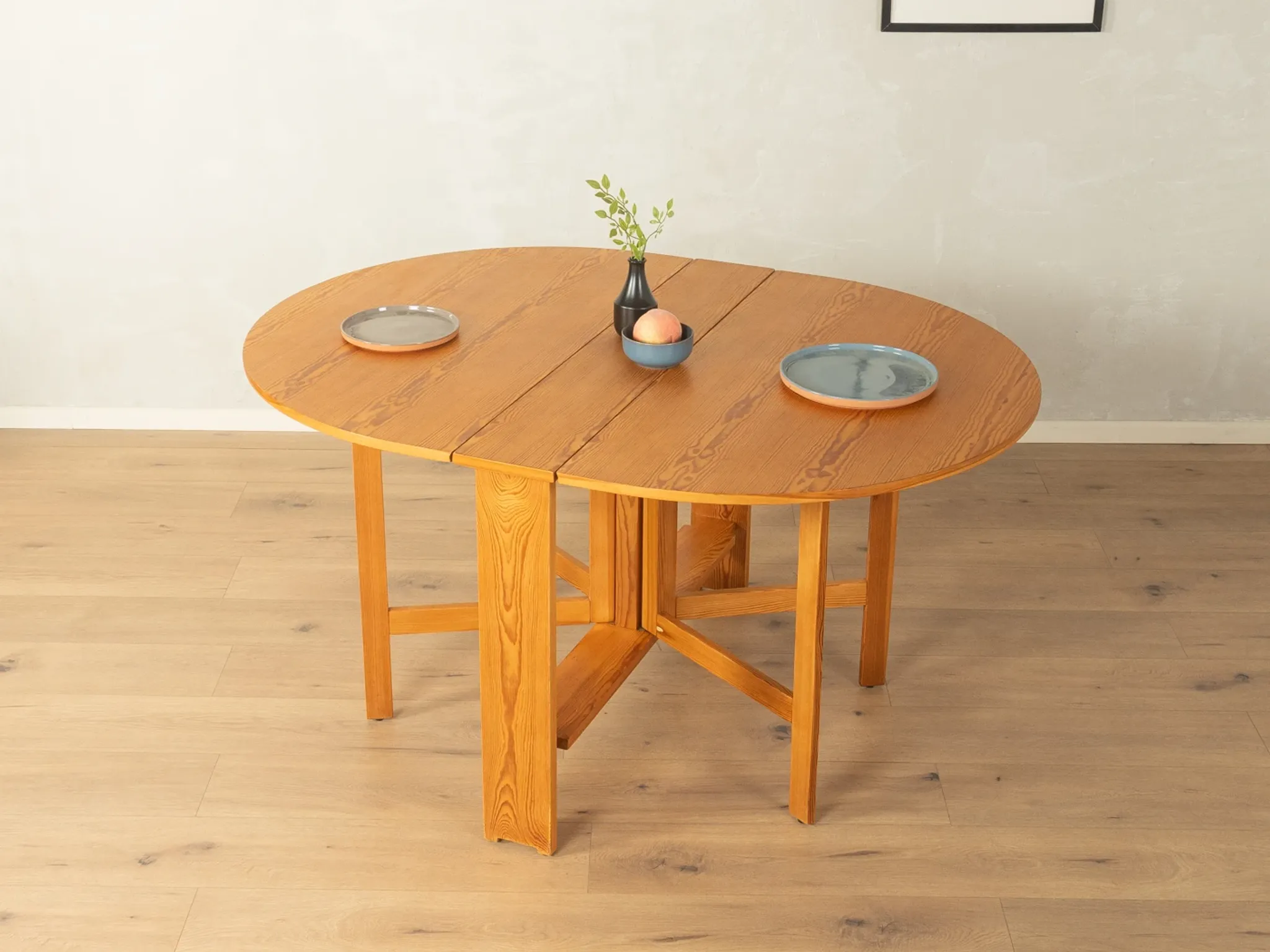 Practical folding table from the 1980s made of light brown pine wood