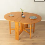 Practical folding table from the 1980s made of light brown pine wood