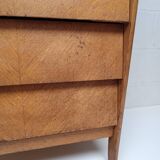 High wooden chest of drawers in the 50s