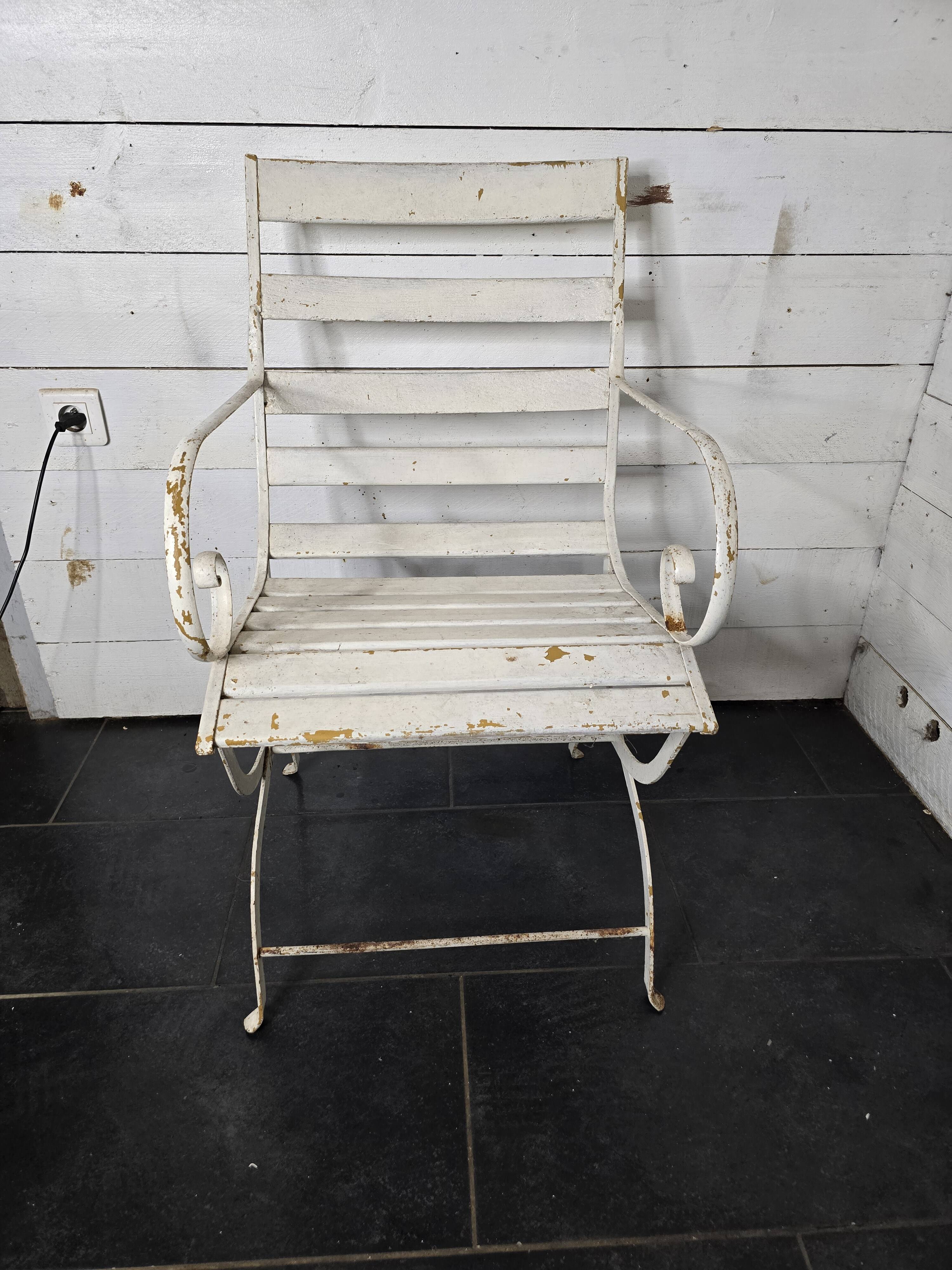 Old wrought iron and wood garden armchair