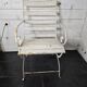 Old wrought iron and wood garden armchair