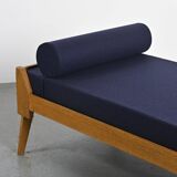 Wooden bench with midnight blue fabric, France, circa 1955